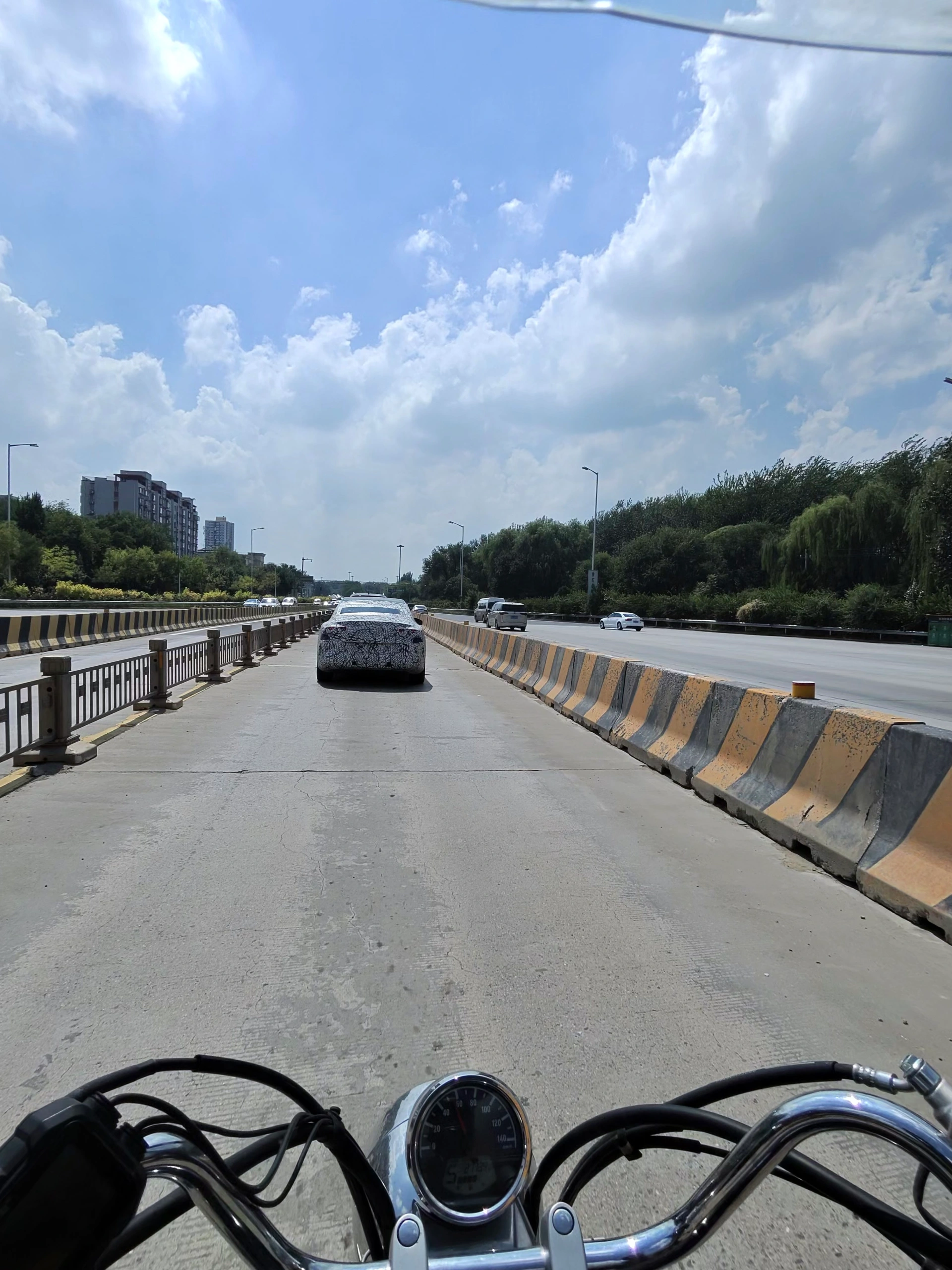 Source image for Motorcycle Chase Following Camouflaged Prototype on Sunny Highway